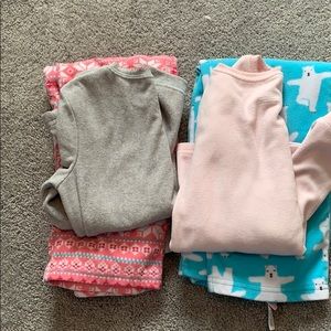Set of two Carter’s fleece pajama sets.